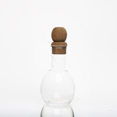 Bouteille à huile en verre avec support en bois